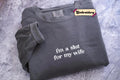 A gray sweatshirt with the text "i'm a shut for my wife" embroidered on it.